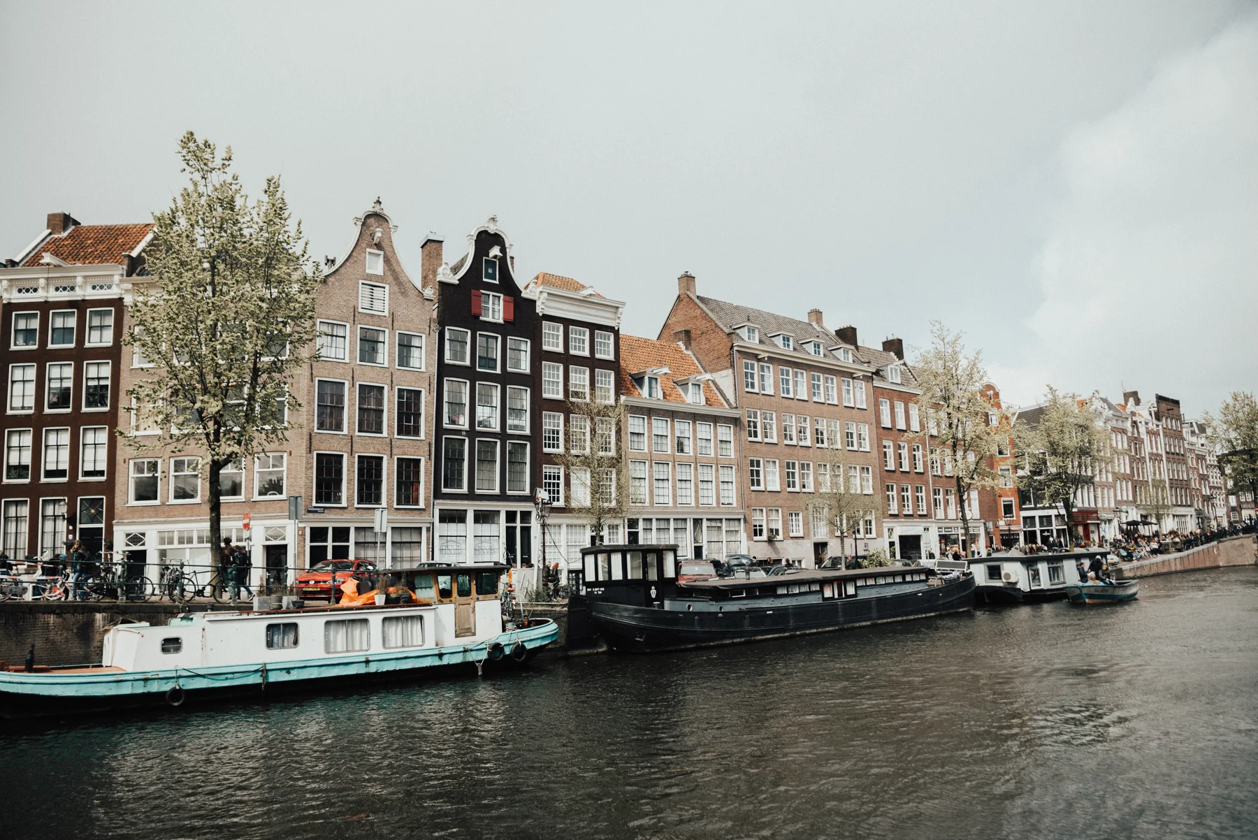 Historic canal houses beside the water in Amsterdam